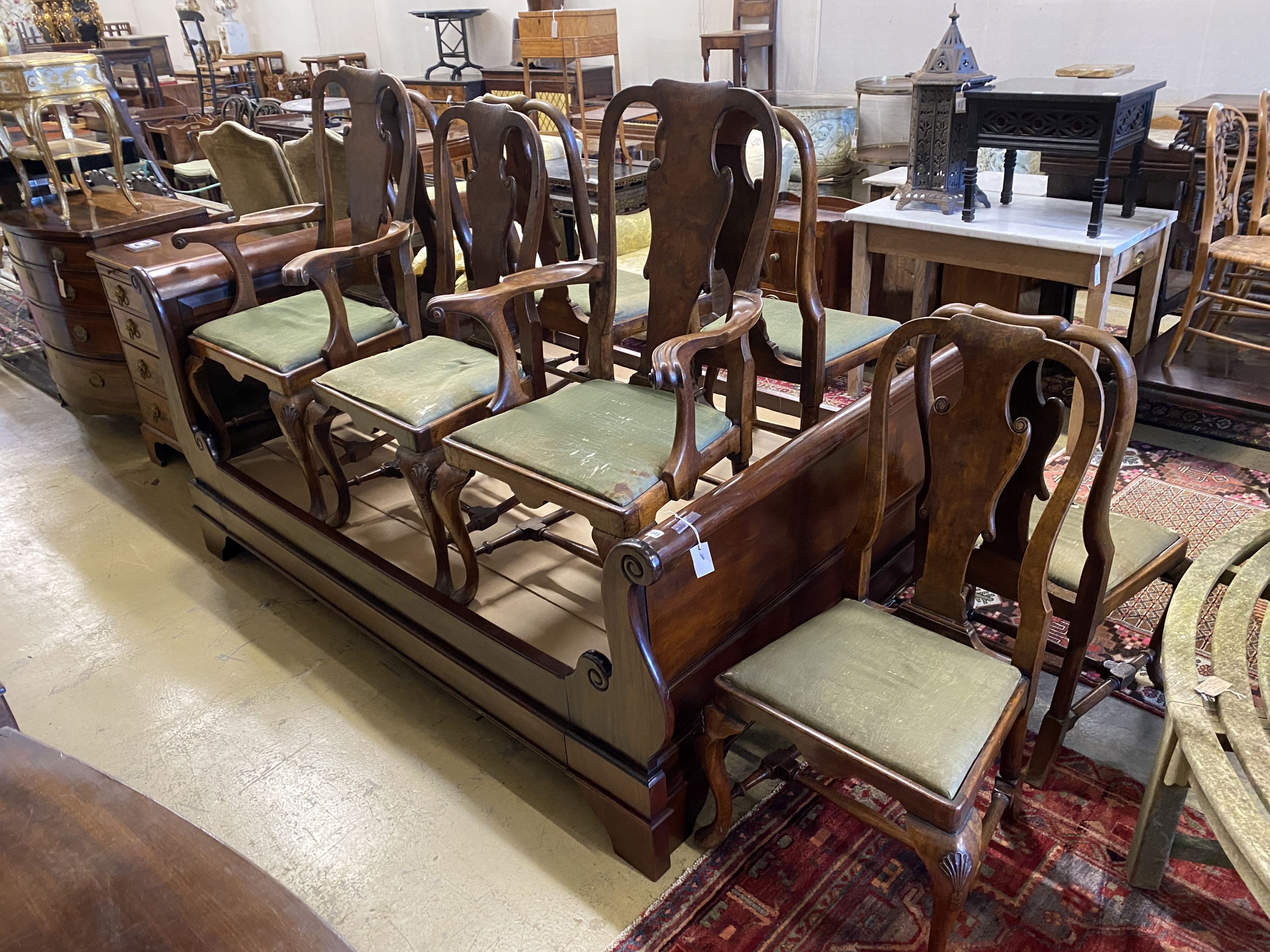 A set of eight George I style walnut dining chairs, two with arms.